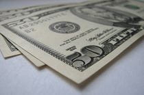 A small pile of 50 dollar bills.