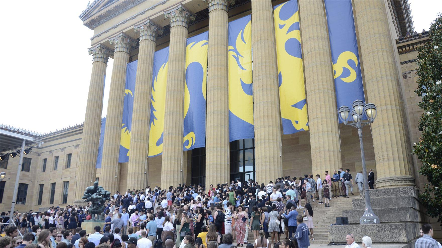Students head up the stairs into the art museum.