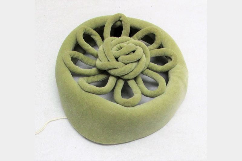 Sage green velvet pillbox. Open on top with self fabric cording decoration. Two brown plastic combs inside.